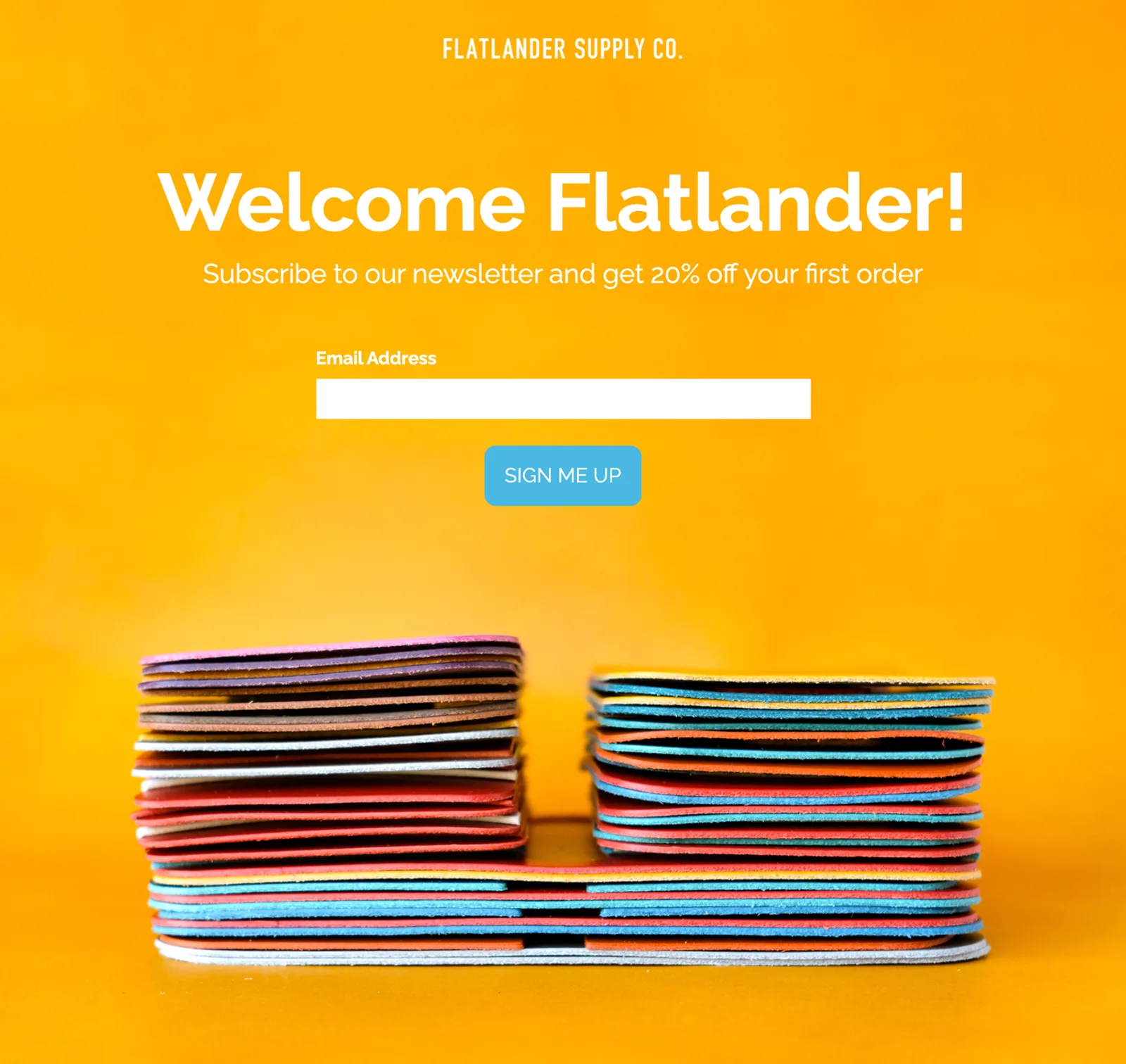 The newsletter capture screen — Welcome Flatlander, twenty percent off a first order, over a photograph of stacked dyed leather
